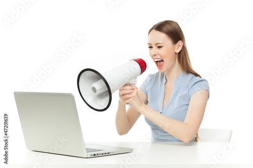 Photo: Businesswoman yelling at laptop Businesswoman yelling at laptop