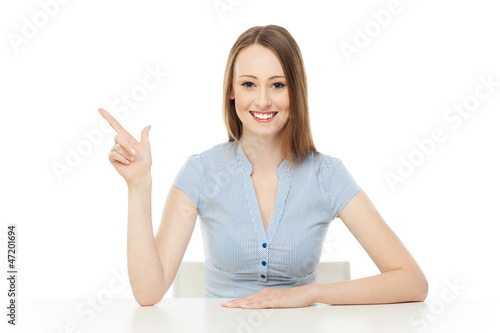 Photo: Young woman pointing Young woman pointing