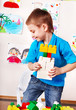 Child playing construction set.