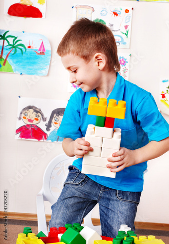 Photo: Child playing construction set. Child playing construction set.
