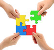 Hands and puzzle Team