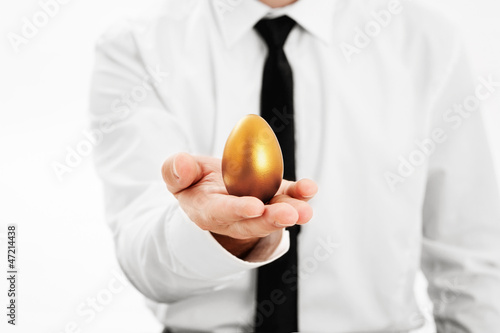 Photo: Golden egg in hand businessman Golden egg in hand businessman