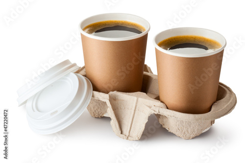 Photo: Two opened take-out coffee in holder Two opened take-out coffee in holder