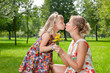 girl kissing her mother