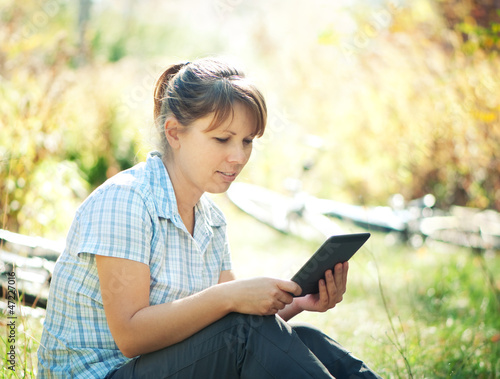 Photo: woman using tablet PC woman using tablet PC