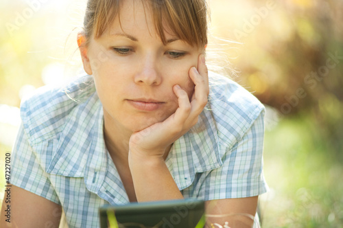 Photo: woman using tablet PC woman using tablet PC