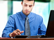 Business man working with laptop and calculator in office