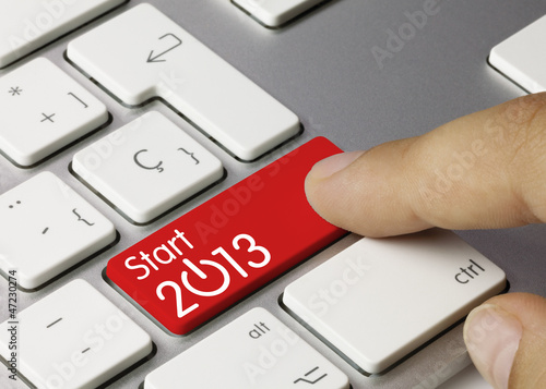 Photo: Start 2013 keyboard key. Finger Start 2013 keyboard key. Finger