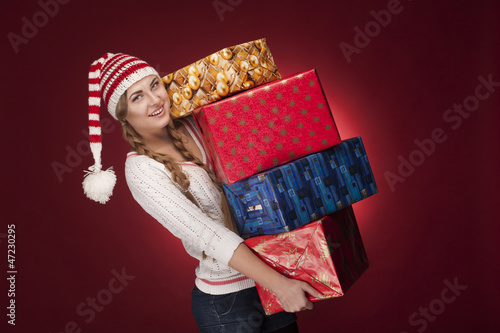 Photo: women with Santa hat with presents women with Santa hat with presents