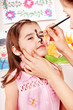 Child preschooler with face painting.