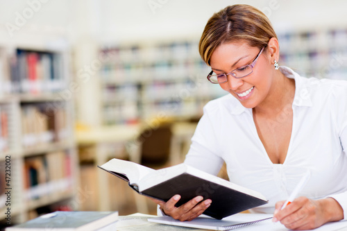 Photo: Woman studying at the library Woman studying at the library