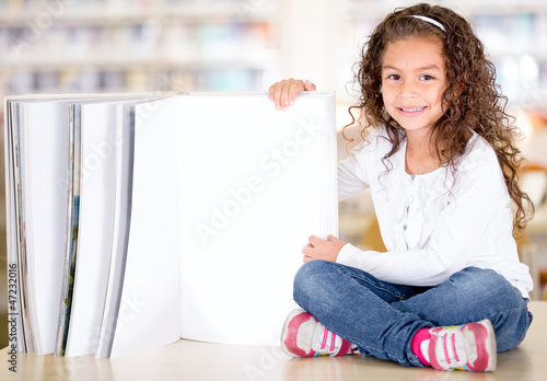Photo: Little girl with a book Little girl with a book
