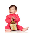 Adorable baby playing with a present