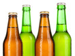 Coloured glass beer bottles isolated on white