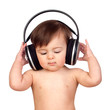 Adorable baby girl with big headphones