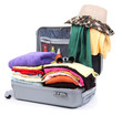 Open silver suitcase with clothing isolated on white