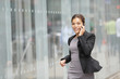 Business woman busy on mobile phone running