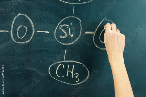 Photo: Chemical structure formula written on blackboard with chalk. Chemical structure formula written on blackboard with chalk.