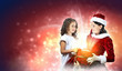 Little girl with christmas gifts and santa