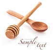 Wooden honey dipper and spoon isolated on white background