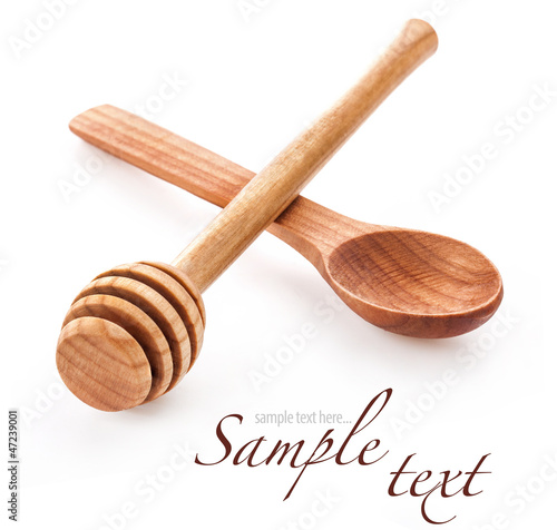 Photo: Wooden honey dipper and spoon isolated on white background Wooden honey dipper and spoon isolated on white background