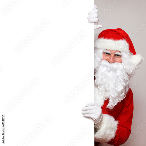 Photo: Santa schaut um die Ecke Santa schaut um die Ecke