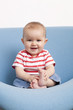 baby playing at eating his feet