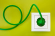 Green Power Plug Into White Po...