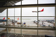 window of the airport with flight arrival