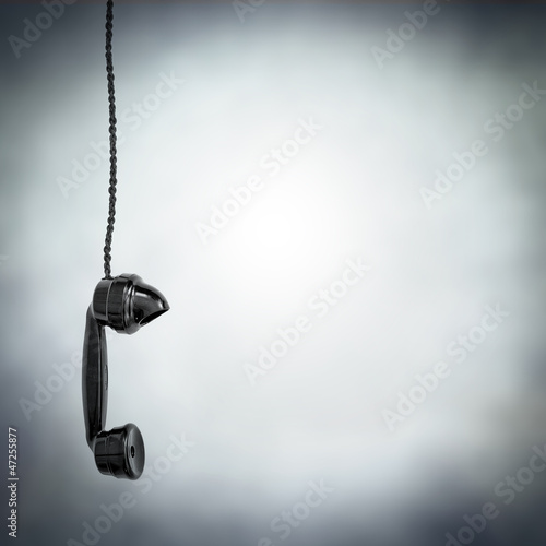 Photo: black phone hanging black phone hanging