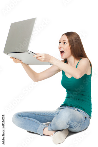 Photo: Excited female holding laptop Excited female holding laptop