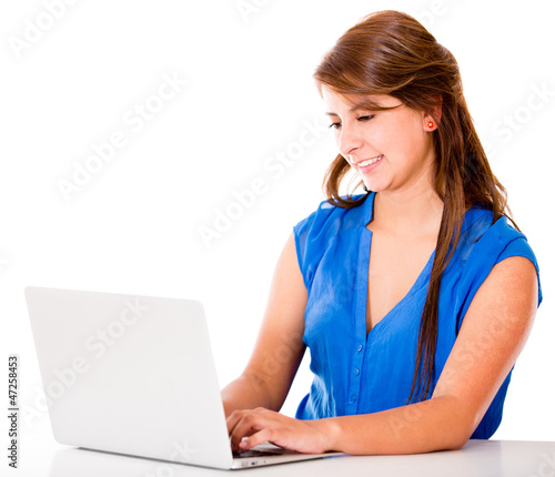 Photo: Woman working on a laptop Woman working on a laptop