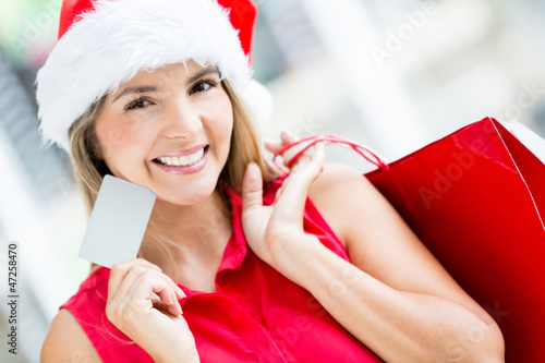 Photo: Woman shopping for Christmas Woman shopping for Christmas