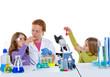 children girlas and teacher woman at school laboratory