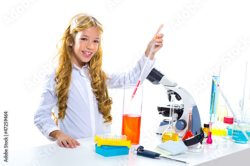 Photo: Children student girl in kid chemical laboratory Children student girl in kid chemical laboratory
