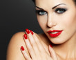 Photo of woman with fashion red nails and  lips