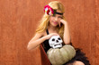 Photo: halloween kid girl with pumpkin and skull smiling halloween kid girl with pumpkin and skull smiling