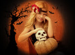 Photo: halloween kid girl with pumpkin and skull smiling halloween kid girl with pumpkin and skull smiling