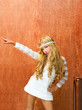Blond children girl retro 70s with vintage furniture