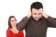 Photo: Couple having an argument. Focus on man Couple having an argument. Focus on man