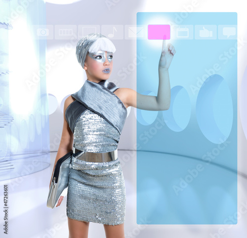 Photo: futuristic children girl in silver touch finger copyspace futuristic children girl in silver touch finger copyspace