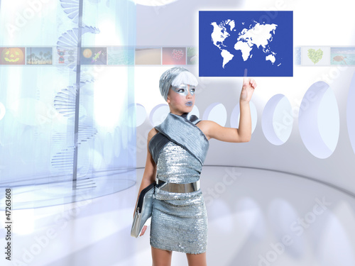 Photo: futuristic children girl in silver touch finger world map futuristic children girl in silver touch finger world map