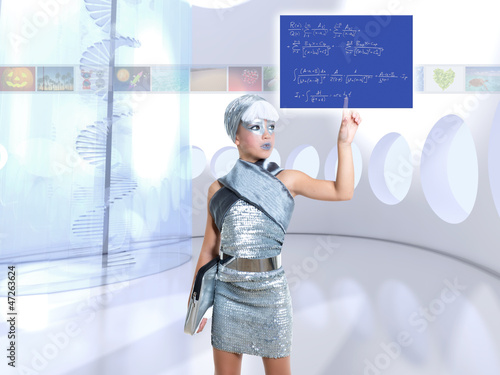 Photo: futuristic children girl in silver touch finger math formula futuristic children girl in silver touch finger math formula