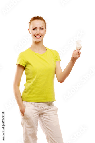 Photo: A woman with an energy-saving bulb in her hands A woman with an energy-saving bulb in her hands