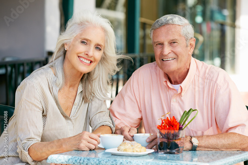 Photo: Senior Couple Enjoying Snack At Outdoor Café Senior Couple Enjoying Snack At Outdoor Café