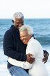Romantic Senior Couple Hugging On Beach
