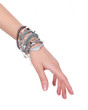collection of bracelets on woman hand isolated