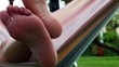 Video: Woman lying in a hammock relaxed Woman lying in a hammock relaxed