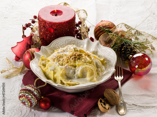 Photo: ravioli with cream and walnut on christmas table ravioli with cream and walnut on christmas table
