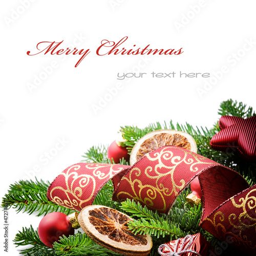 Photo: Border with Christmas tree branches and festive decorations Border with Christmas tree branches and festive decorations